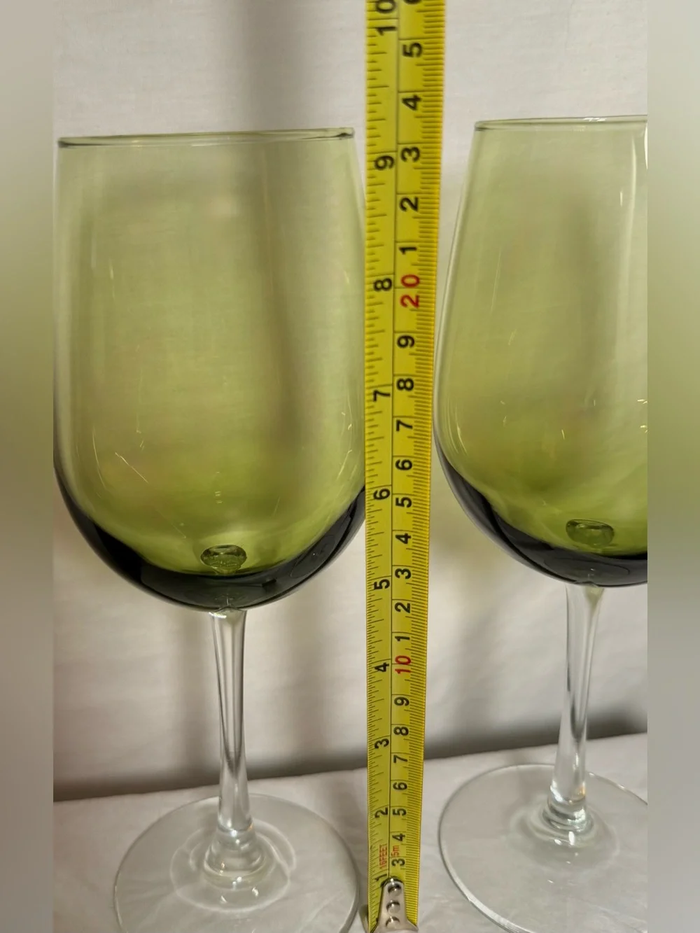2 Pier 1 Pantiago wine glasses. Olive green bowl paired with a clear stem. 16oz